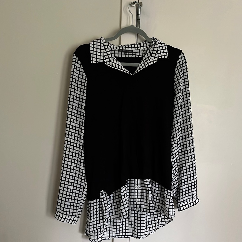 Black and white sweater and button up shirt combined.